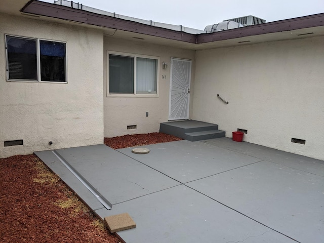 doorway to property with a patio area