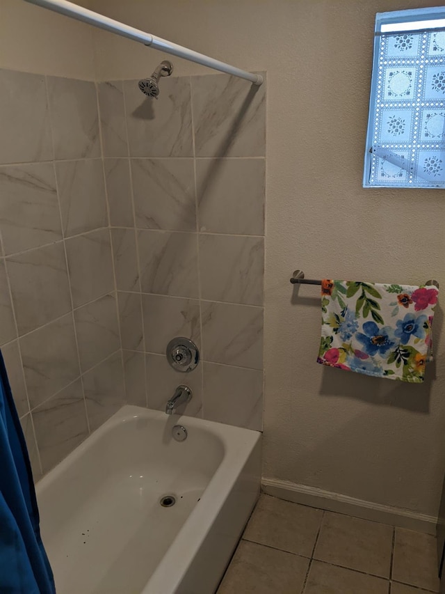 bathroom with tile patterned flooring and shower / tub combo with curtain