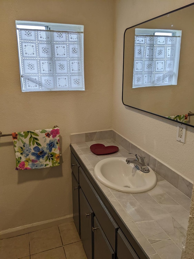 bathroom with vanity and tile patterned flooring