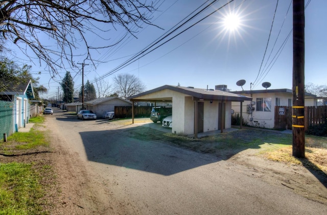 exterior space with a carport