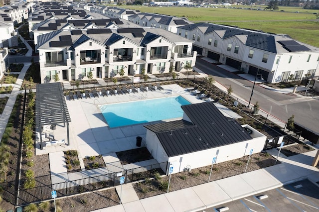 exterior space with a residential view and fence