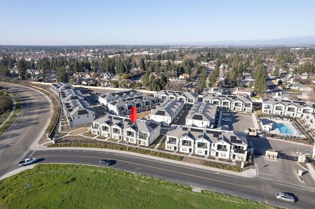 birds eye view of property with a residential view