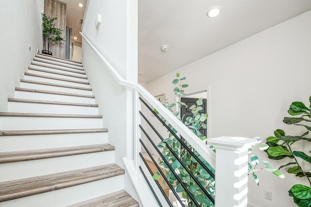 stairs with recessed lighting