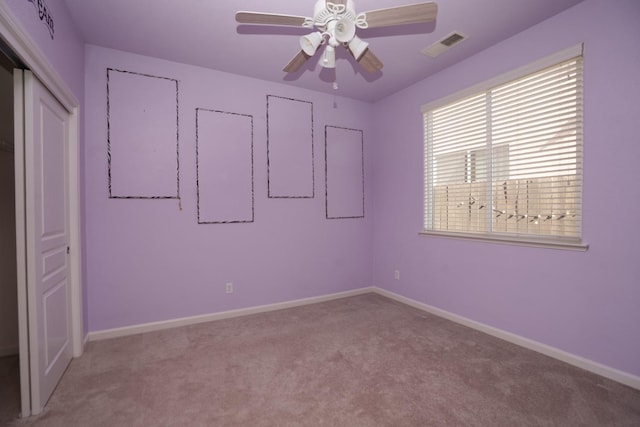 unfurnished bedroom with ceiling fan and light carpet