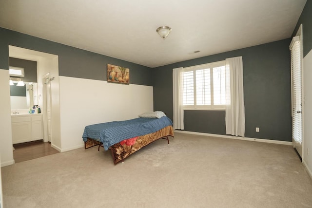 bedroom featuring carpet and ensuite bathroom