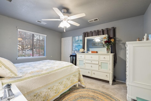 carpeted bedroom featuring ceiling fan