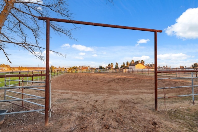 view of yard with a rural view