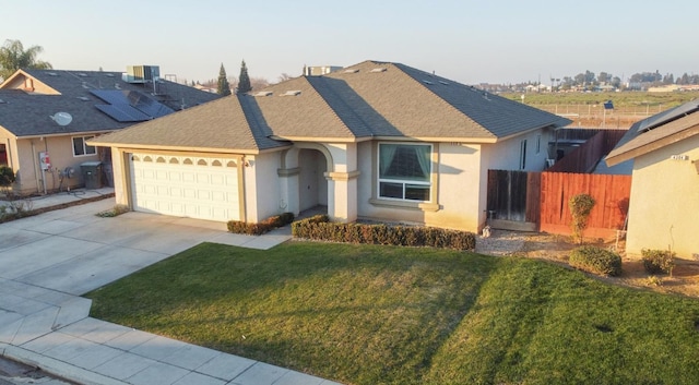 ranch-style house featuring a garage, cooling unit, and a front lawn