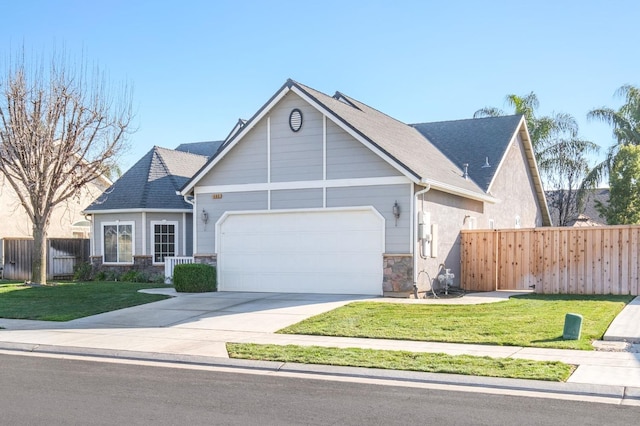 view of front of home with a garage and a front lawn