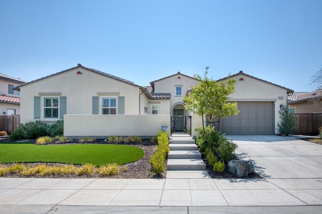 mediterranean / spanish home with a front lawn and a garage