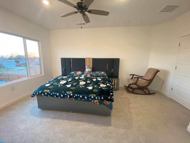 bedroom featuring ceiling fan and light carpet