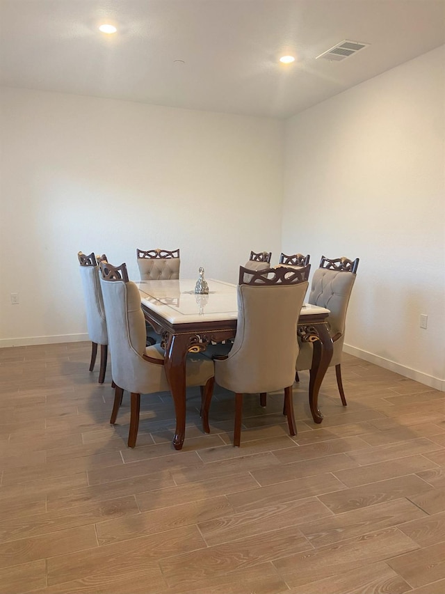 dining room with hardwood / wood-style floors