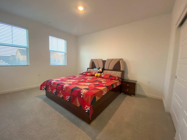 bedroom with light carpet