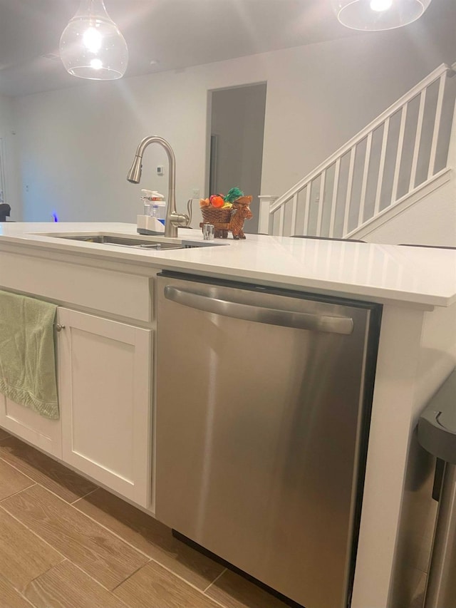 kitchen featuring sink, white cabinets, and stainless steel dishwasher