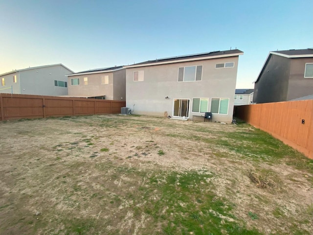 rear view of house with cooling unit