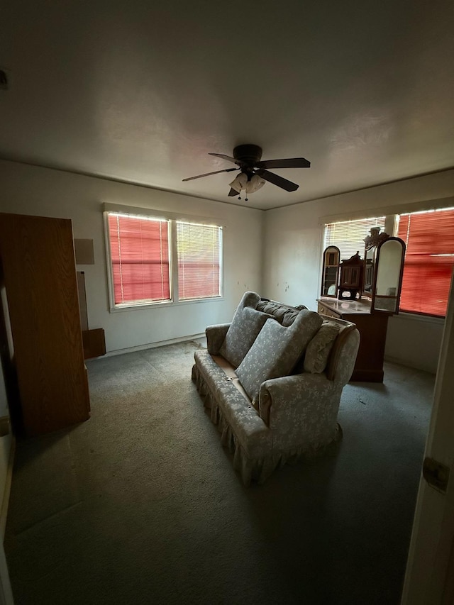 living room featuring carpet floors and ceiling fan