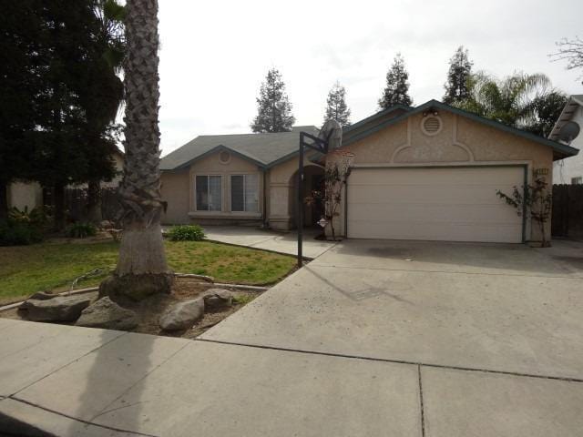 single story home featuring a garage