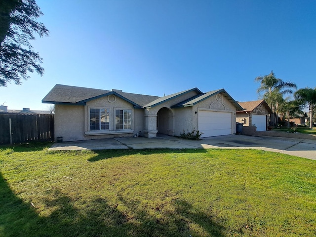 single story home with a front lawn and a garage