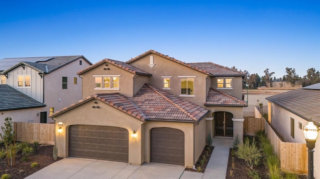 mediterranean / spanish-style home featuring a garage