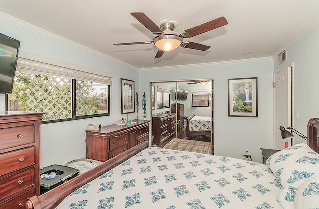 bedroom with ornamental molding, a closet, visible vents, and a ceiling fan