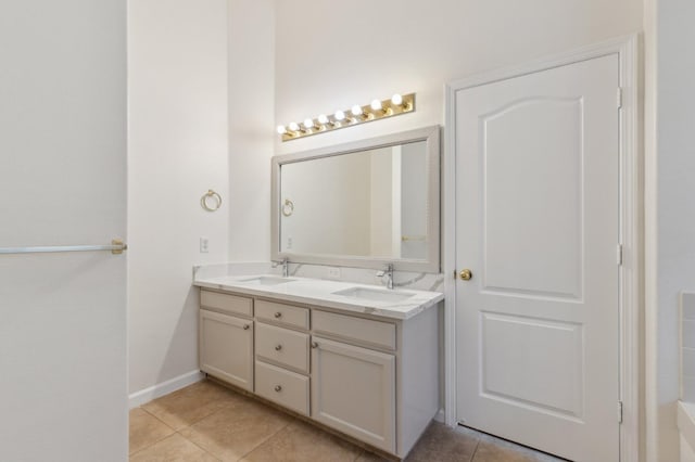 bathroom with tile patterned flooring and vanity