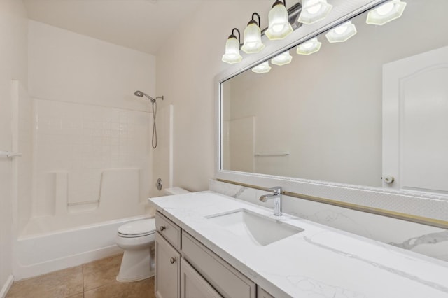 full bathroom with shower / tub combination, tile patterned floors, vanity, and toilet