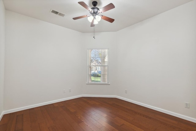 empty room with ceiling fan and hardwood / wood-style flooring