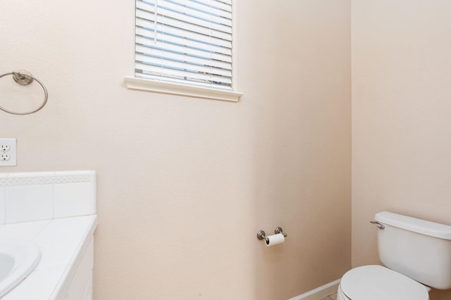 bathroom with toilet and vanity