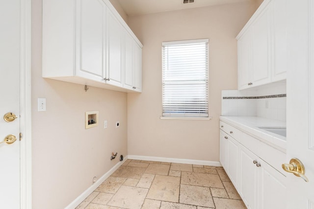 laundry room with washer hookup, cabinets, gas dryer hookup, and electric dryer hookup