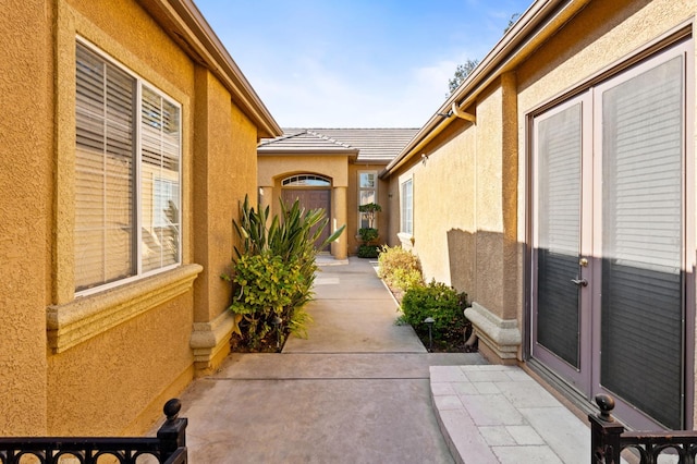 entrance to property featuring a patio area