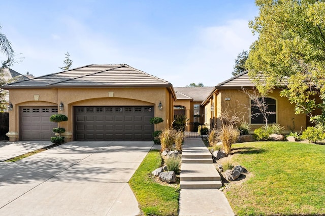 view of front of property with a garage and a front yard