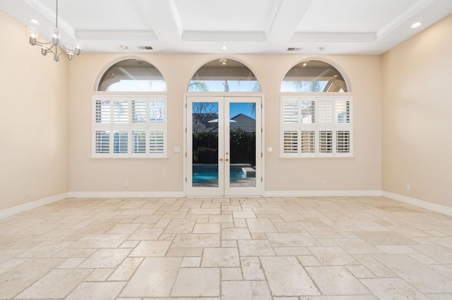 unfurnished room featuring beam ceiling, french doors, and coffered ceiling