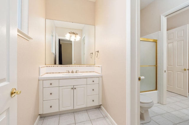 full bathroom with tile patterned floors, enclosed tub / shower combo, vanity, and toilet