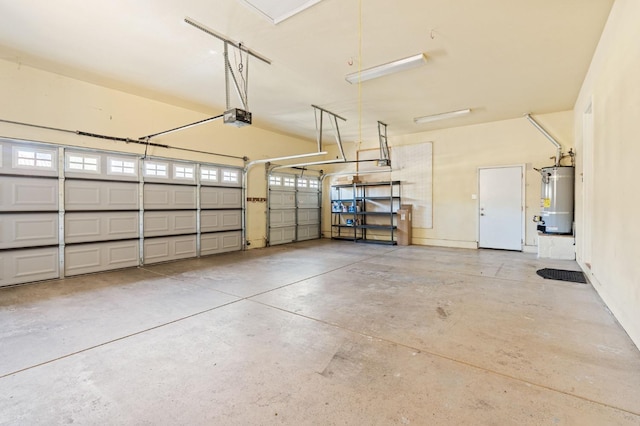 garage featuring water heater and a garage door opener