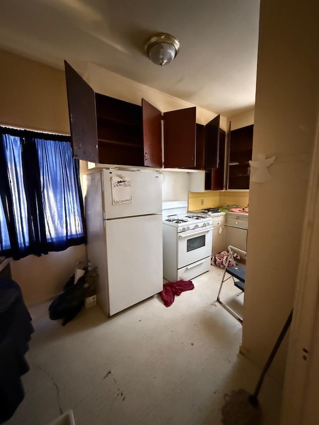 kitchen featuring dark brown cabinets and white appliances