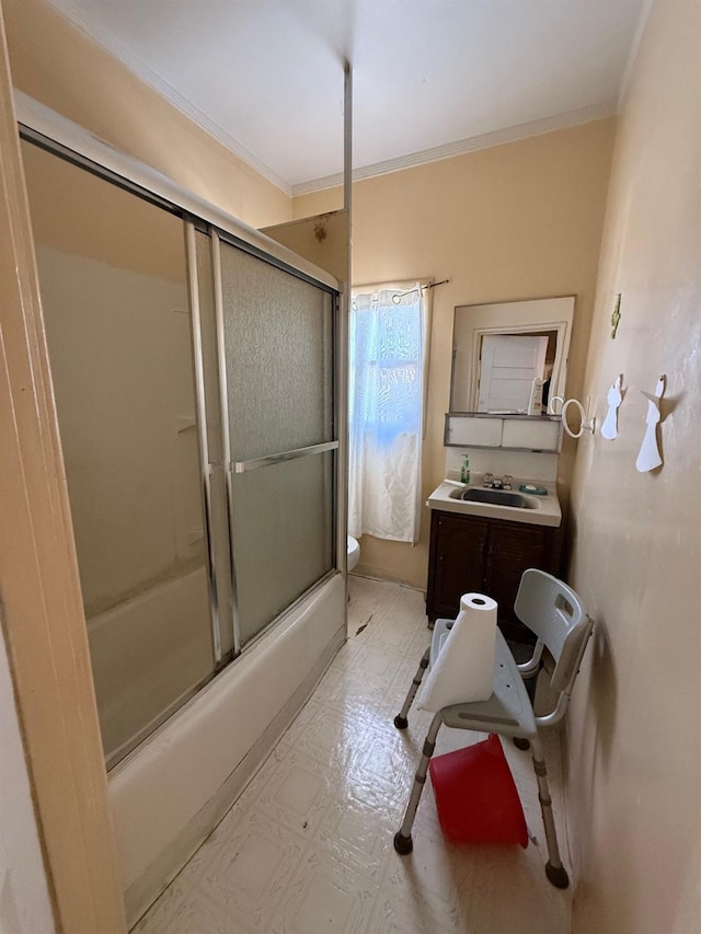 full bathroom with enclosed tub / shower combo, toilet, vanity, and ornamental molding