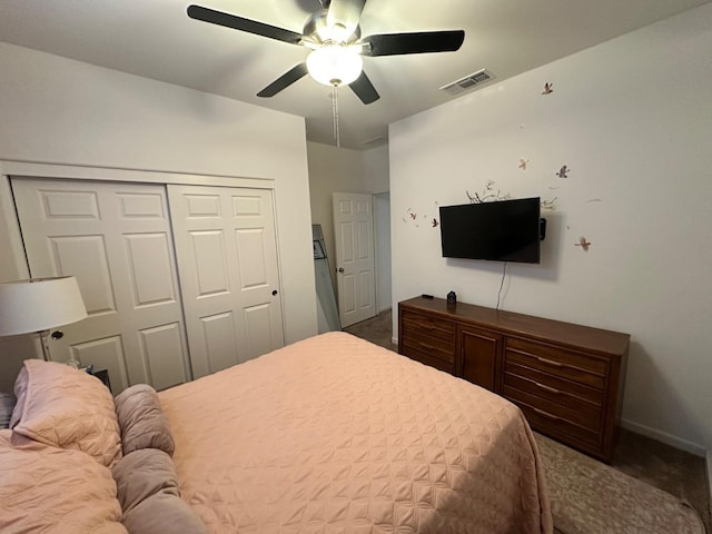 bedroom with ceiling fan, a closet, and carpet