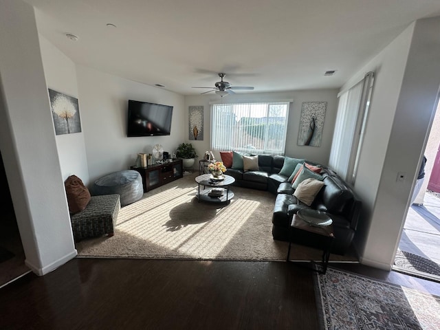 living room featuring ceiling fan and wood-type flooring