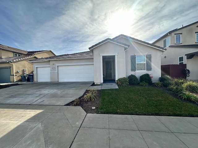 view of front facade with a front yard and a garage