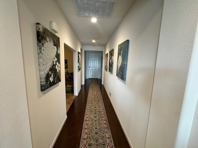 hall with dark hardwood / wood-style flooring