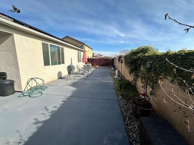 view of side of home featuring a patio