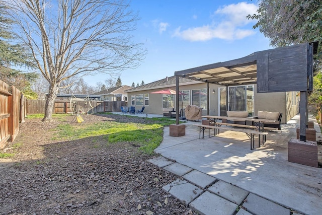 back of property featuring an outdoor hangout area, a pergola, and a patio area