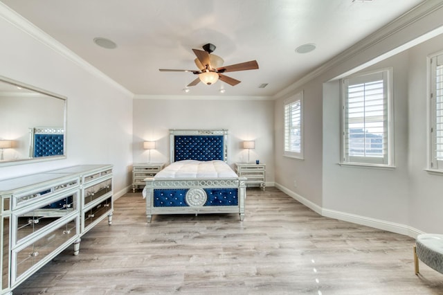 bedroom with crown molding, baseboards, ceiling fan, and wood finished floors