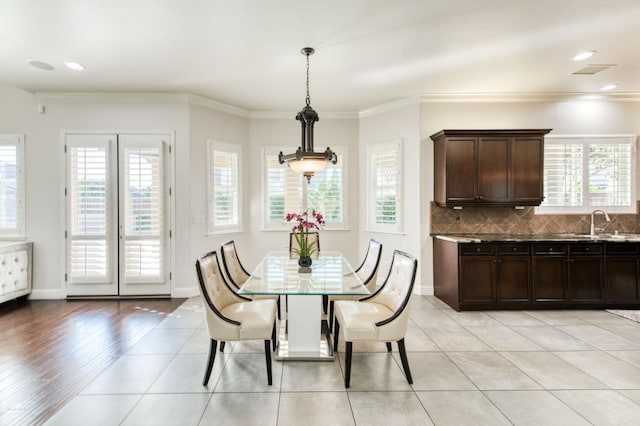 dining room with light tile patterned flooring, recessed lighting, visible vents, baseboards, and ornamental molding