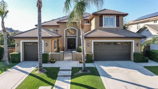 view of front of house with concrete driveway and a tile roof