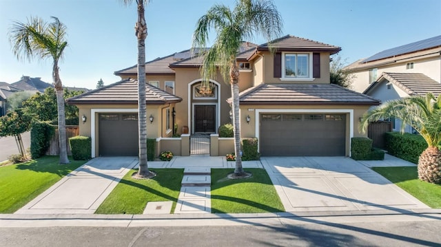 view of front of home with a tile roof, fence, concrete driveway, and stucco siding