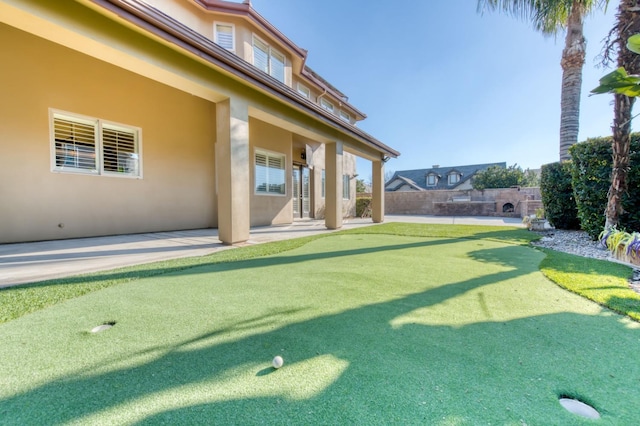 view of yard with a patio and fence