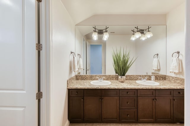 full bathroom featuring double vanity and a sink