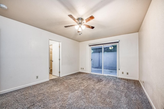 unfurnished room featuring a textured ceiling, carpet flooring, and ceiling fan