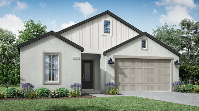 view of front of house with stucco siding, a front yard, and driveway